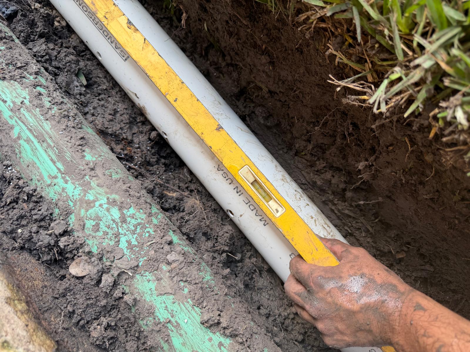 Drainage Solutions: Precision grading and pipe alignment